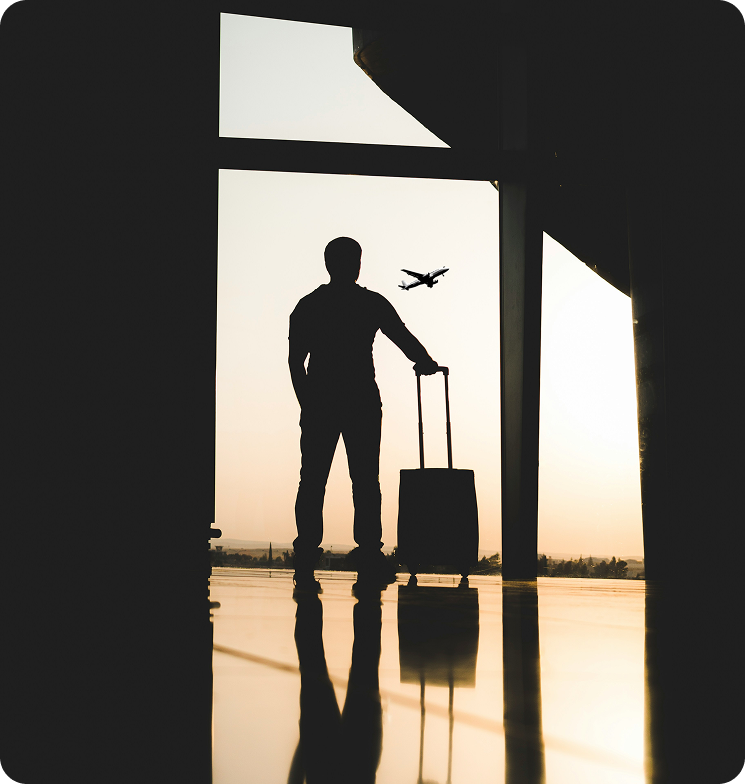 a man looking at a plane depart